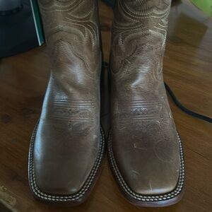 Cowboy boots never worn. Needs a good shoe shine.